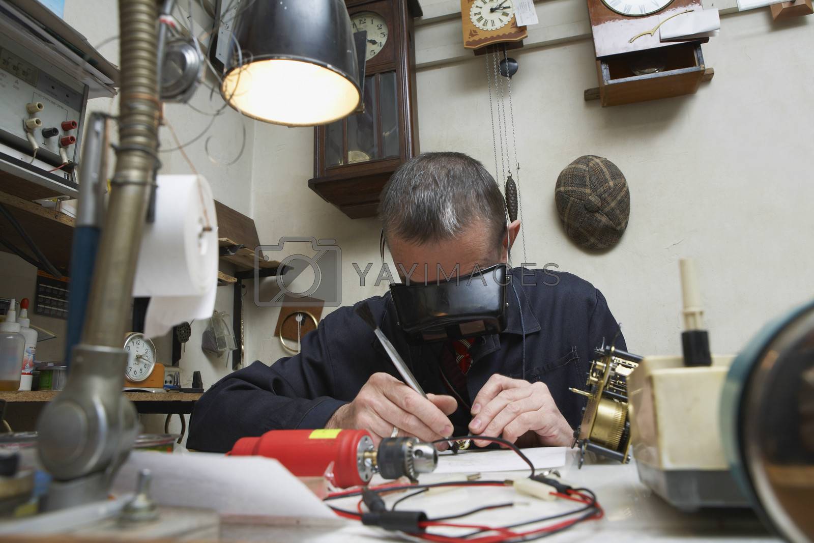 Royalty free image of Clock Repairman at Work by moodboard