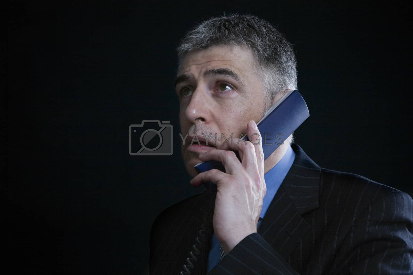 Royalty free image of Worried Businessman on the Telephone by moodboard