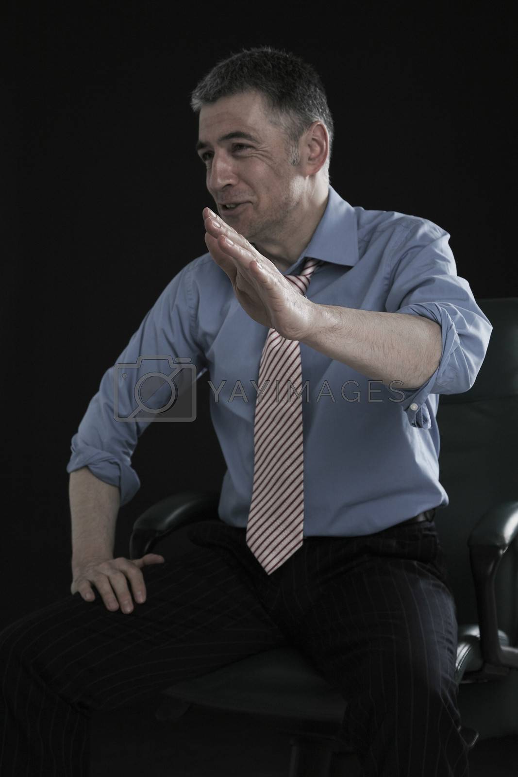 Royalty free image of Businessman Laughing and Gesturing by moodboard