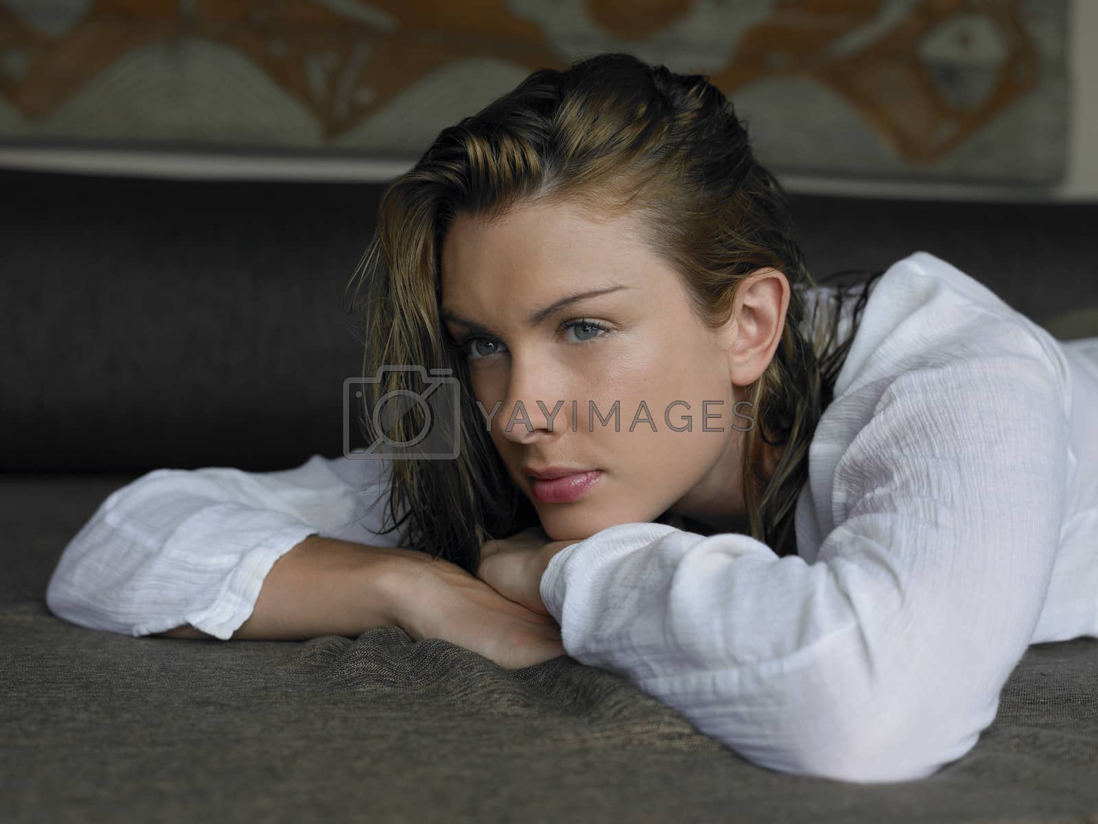Royalty free image of Young Woman Lying on Bed by moodboard