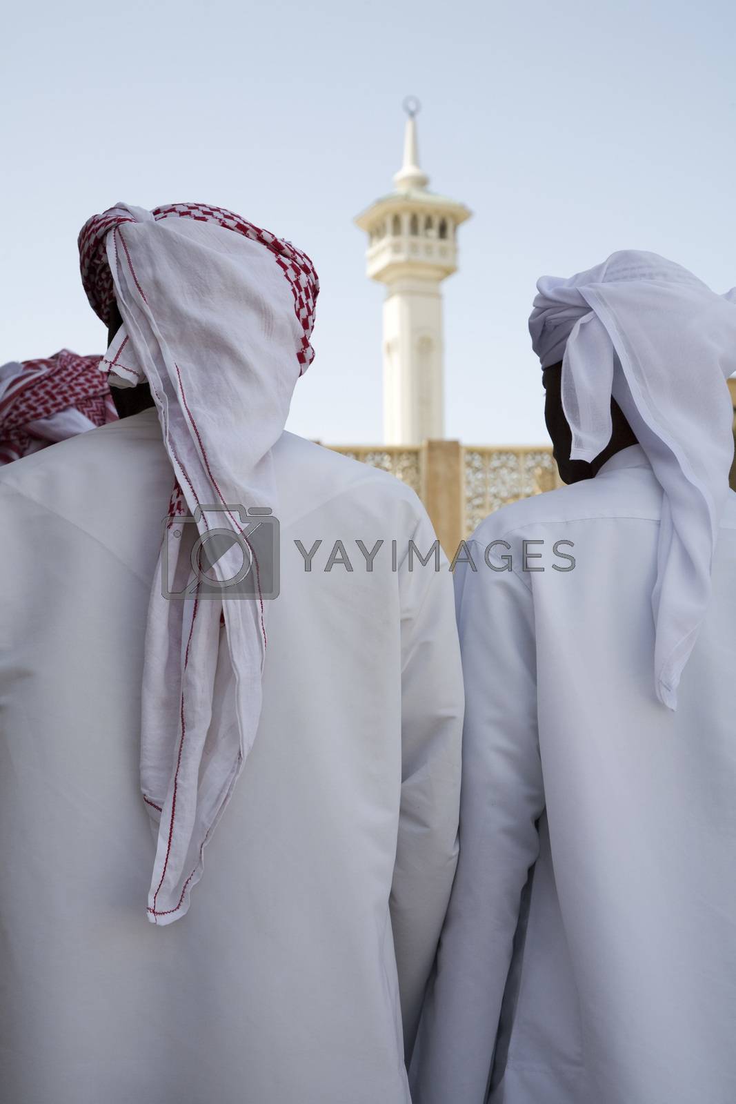 Royalty free image of UAE Dubai group of traditionally dressed Muslim men perform a song for visitors to the Bastakia by moodboard