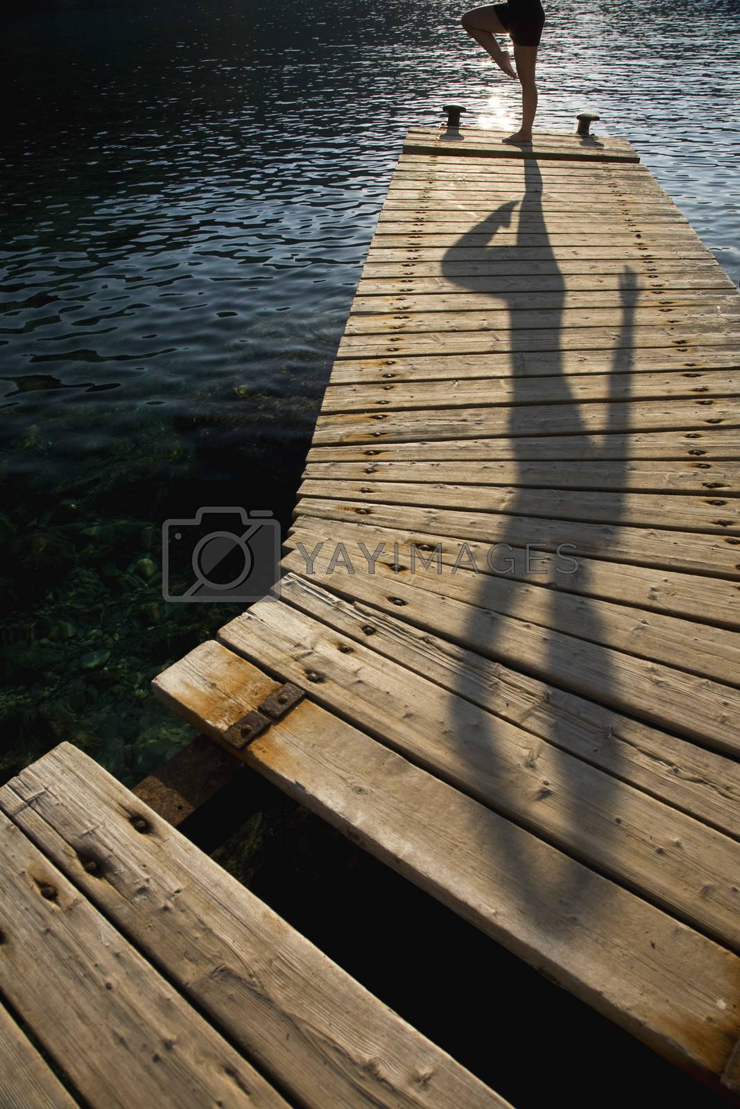 Royalty free image of Person exercising on jetty by moodboard