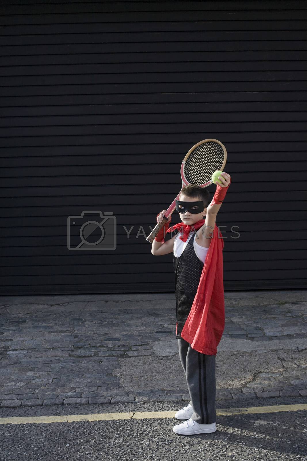 Royalty free image of Boy wearing Zorro costume with tennis racket by moodboard