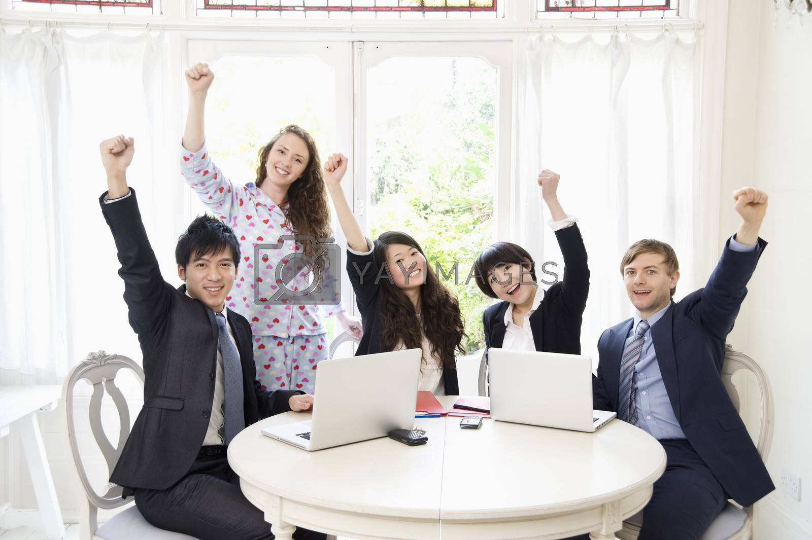 Royalty free image of Excited businesspeople by moodboard