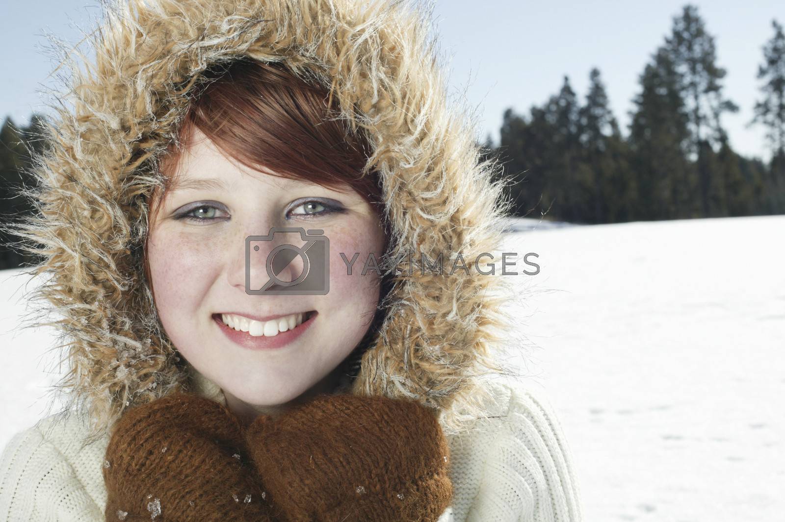 Royalty free image of Portrait of teenage girl in hooded jacket by moodboard