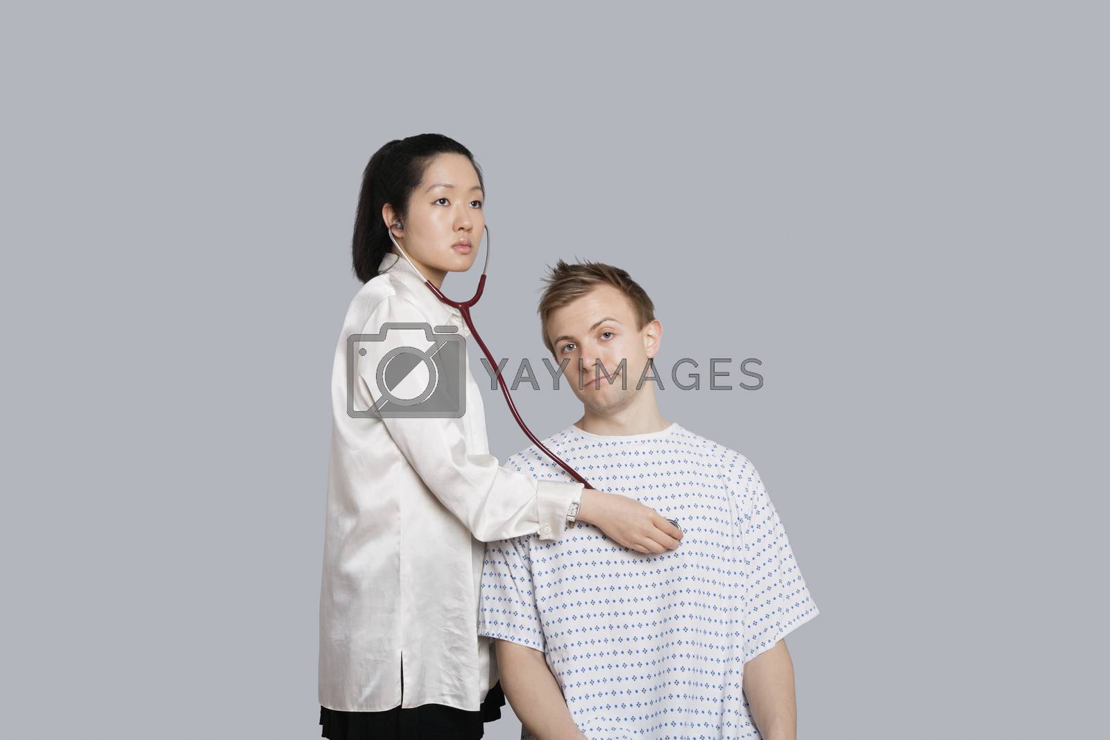 Royalty free image of Patient being examined by the doctor by moodboard
