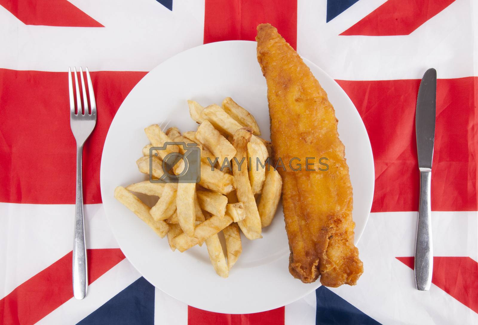 Royalty free image of Close-up of junk food with fork and table knife over British flag by moodboard
