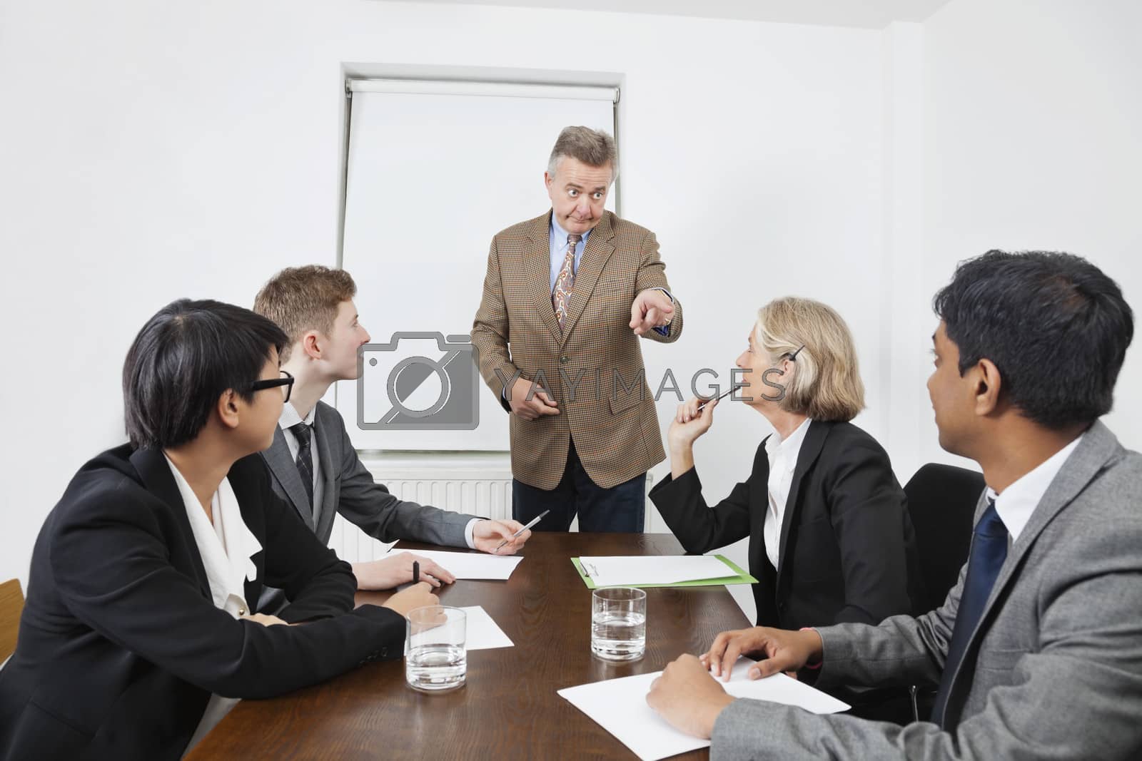 Royalty free image of Multiethnic businesspeople at meeting in conference room by moodboard