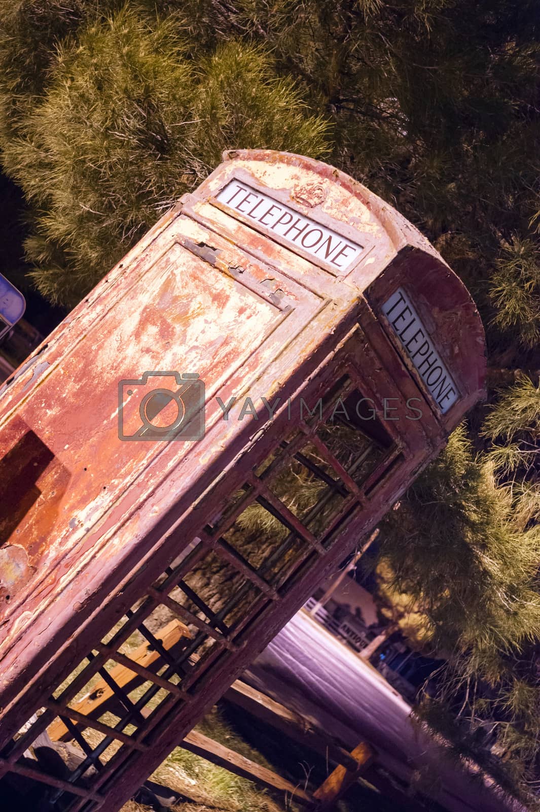 Royalty free image of Skewed Vintage Obsolete Outdoor Telephone Booth Southwest Rural  by ChrisBoswell