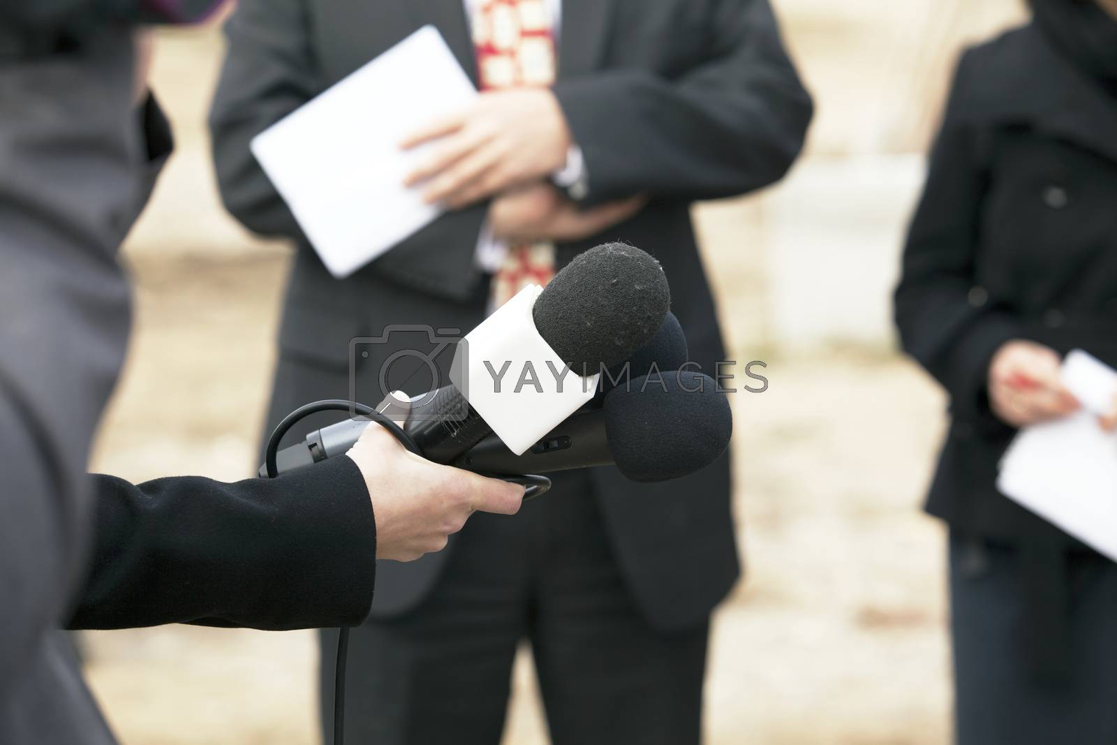 Royalty free image of Media interview by wellphoto