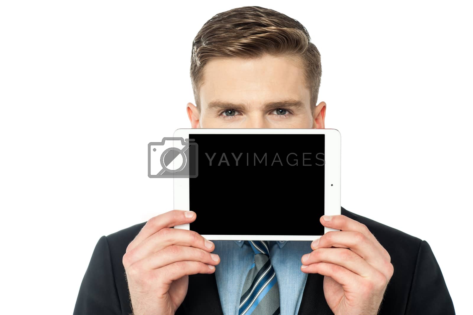 Royalty free image of Man hiding his face with tablet device by stockyimages