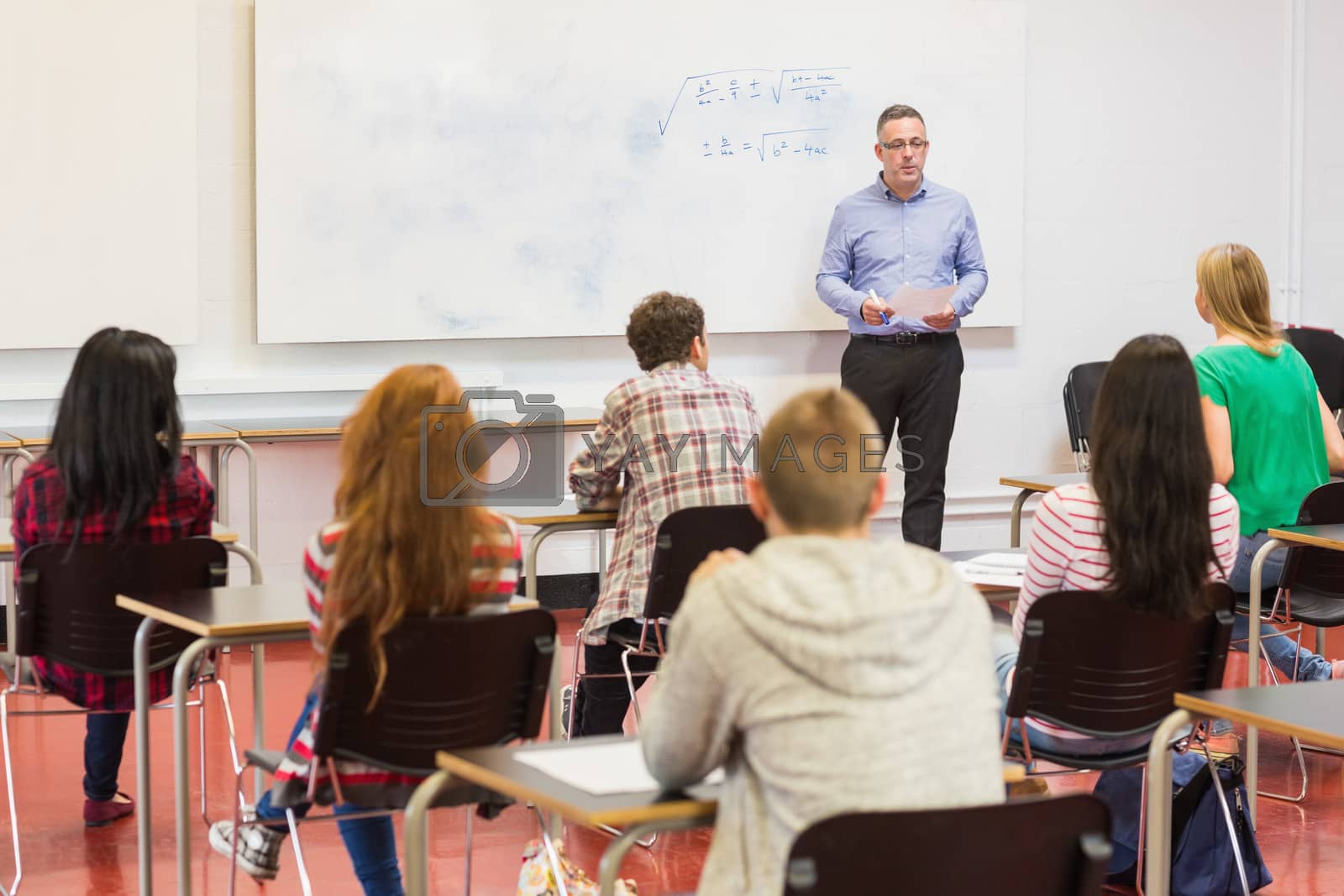 Royalty free image of Attentive students with teacher in the classroom by Wavebreakmedia