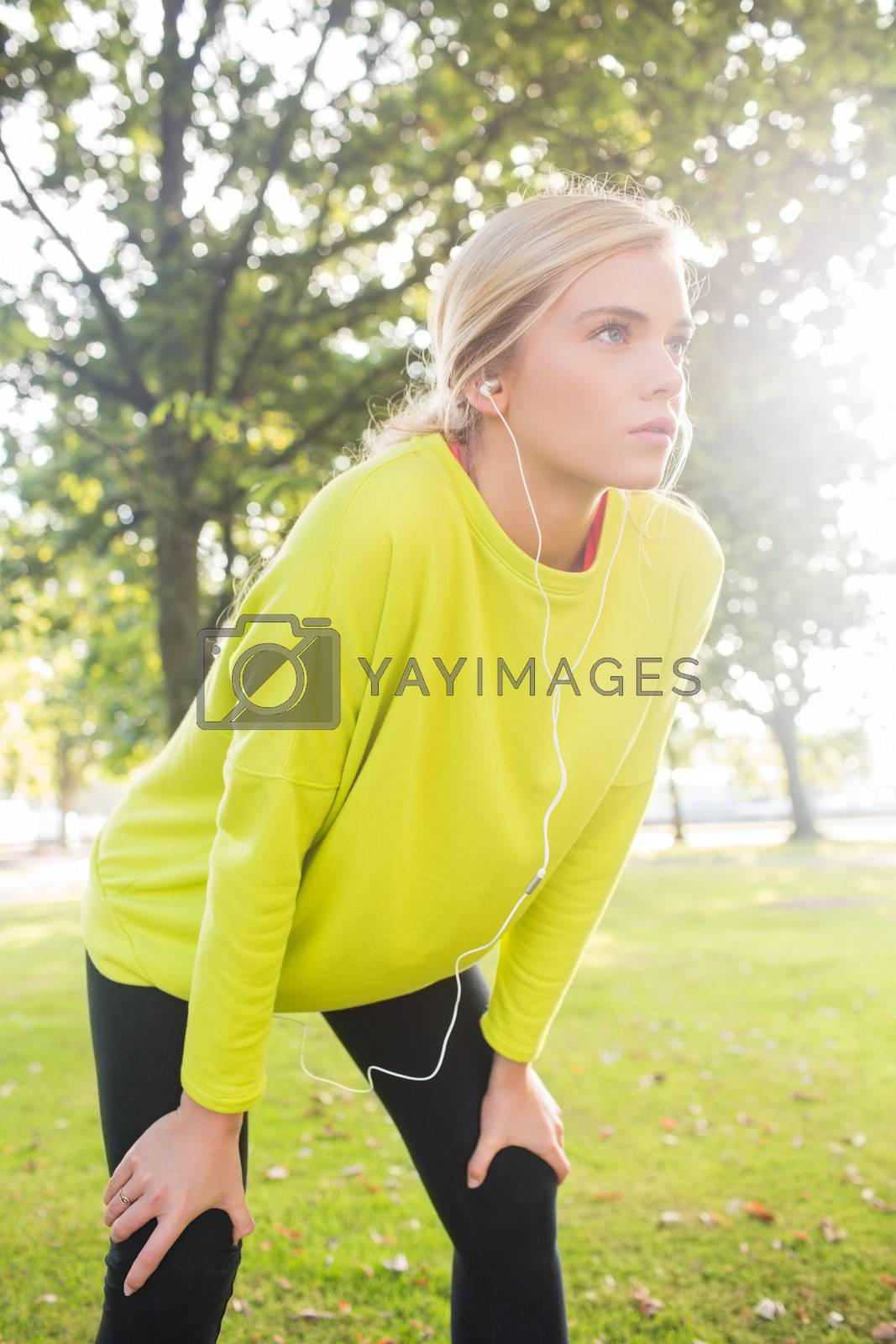 Royalty free image of Active serious blonde catching her breath by Wavebreakmedia