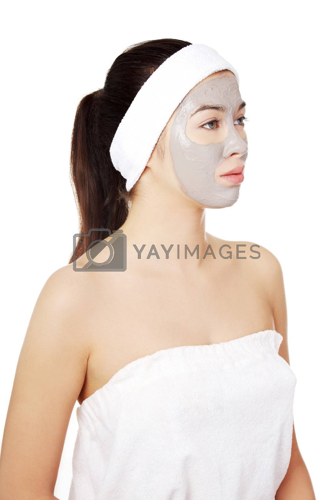 Royalty free image of Beautiful woman with clay facial mask by BDS