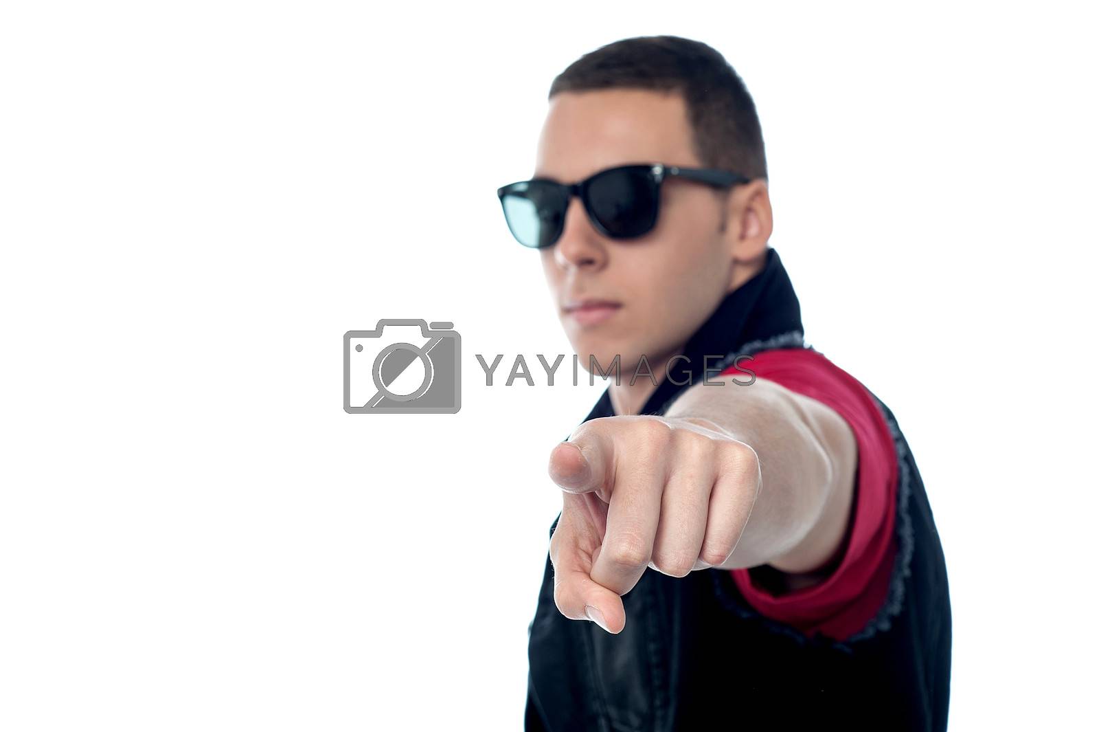 Royalty free image of Smart guy pointing towards camera by stockyimages