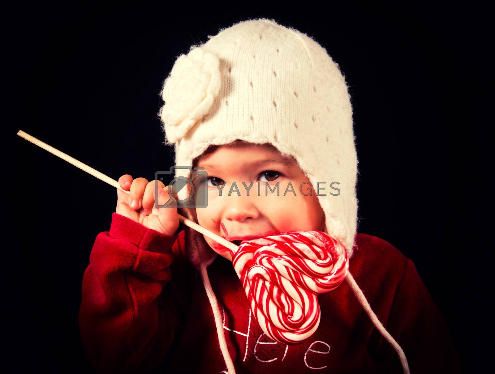 Royalty free image of Baby with lolly pop by badmanproduction