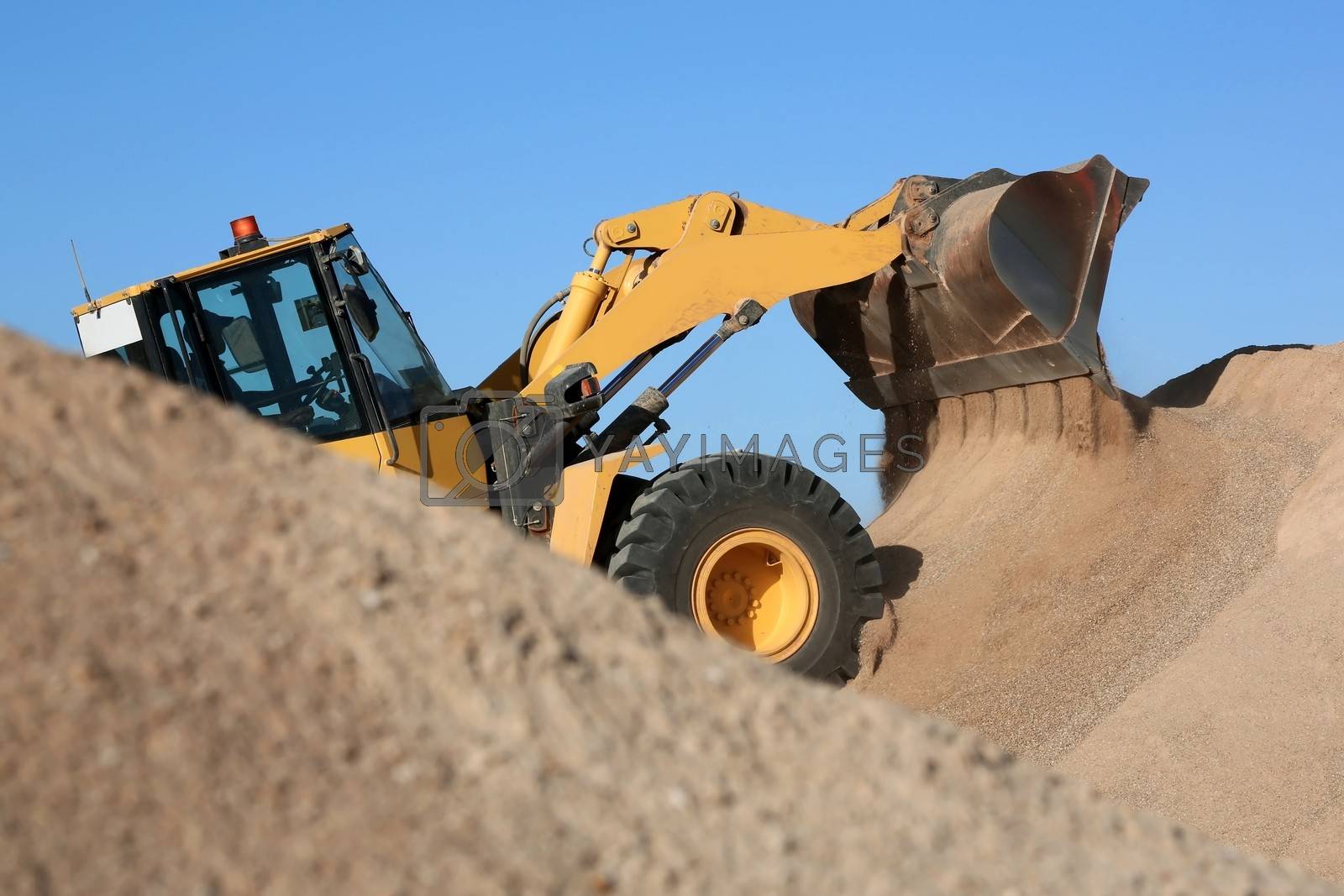 Royalty free image of Bulldozer Working with Sand by fouroaks