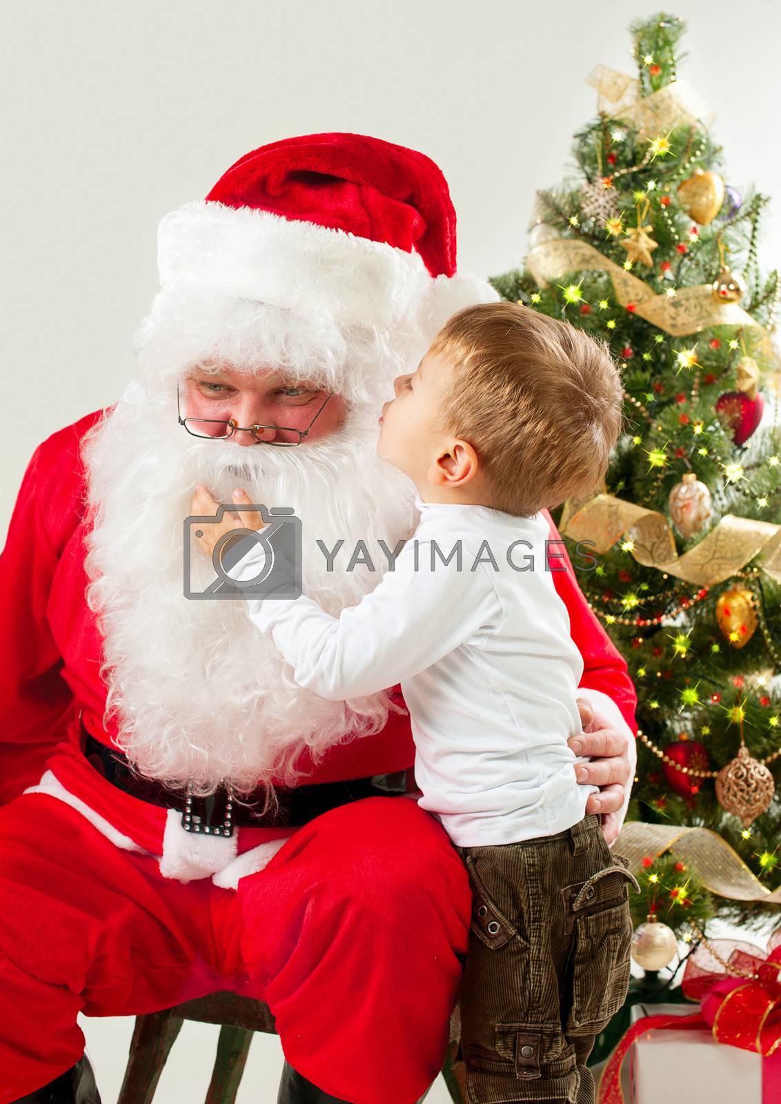 Royalty free image of Santa Claus and Little Boy. Christmas Scene by SubbotinaA
