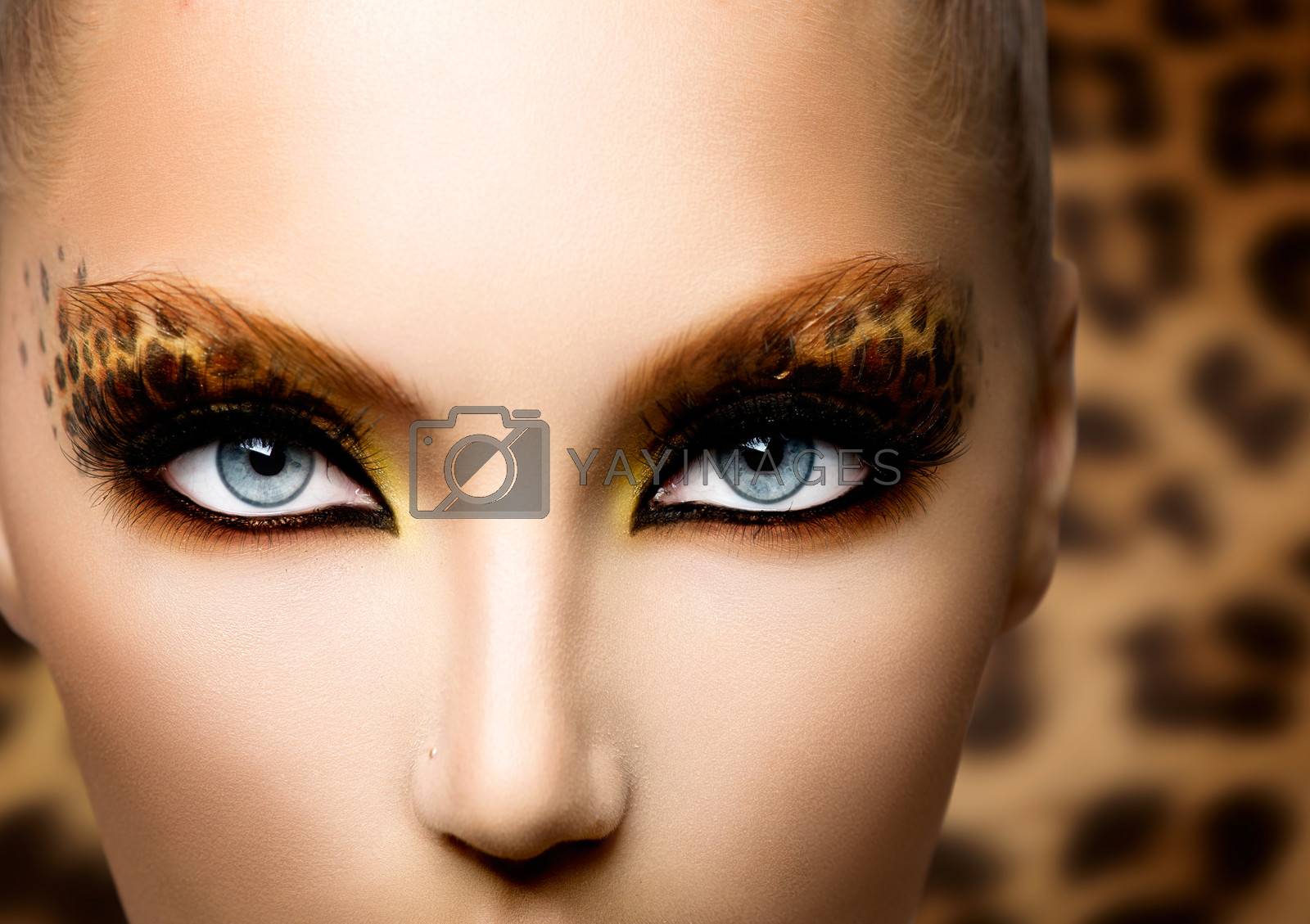 Royalty free image of Beauty Fashion Model Girl with Holiday Leopard Makeup by SubbotinaA