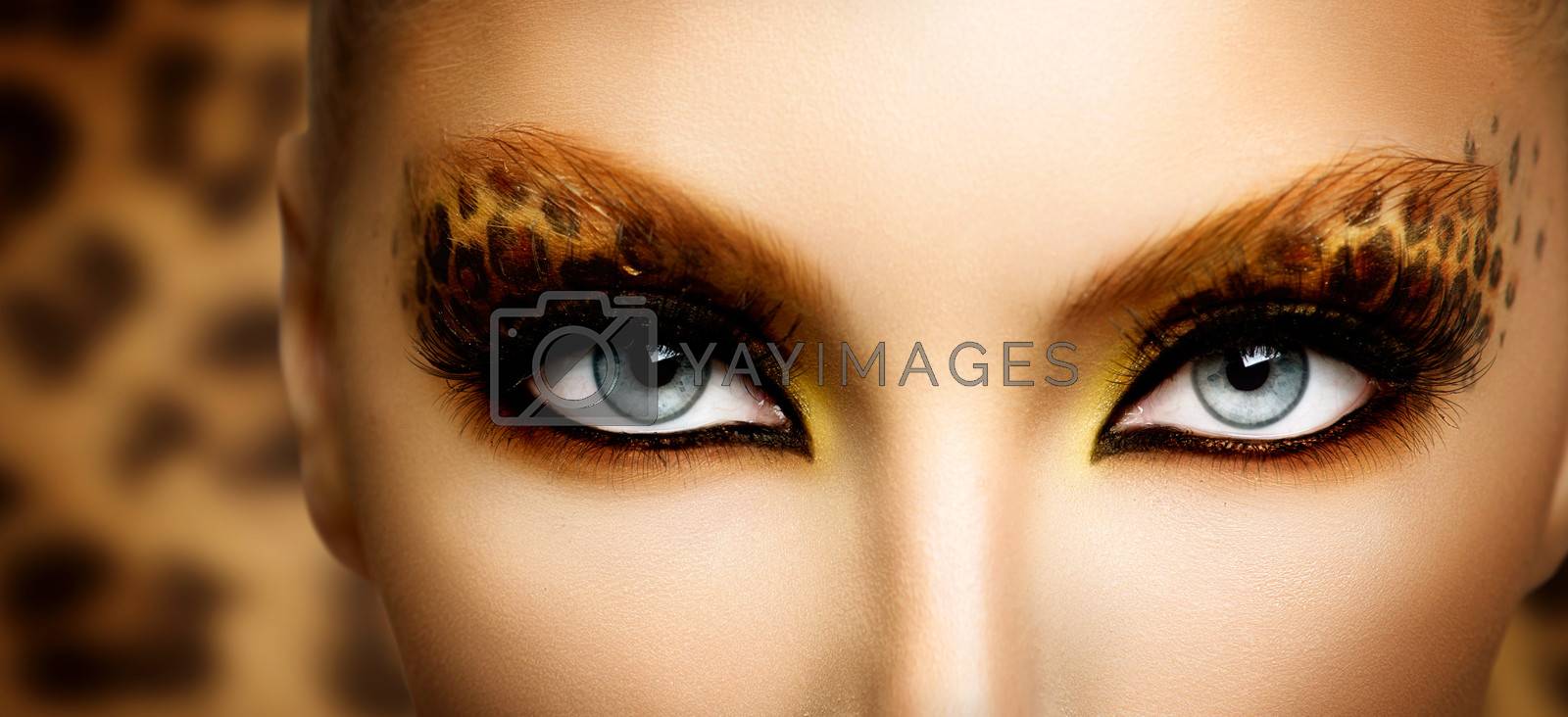 Royalty free image of Beauty Fashion Model Girl with Holiday Leopard Makeup by SubbotinaA