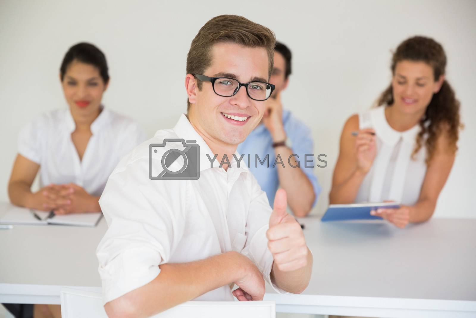 Royalty free image of Male candidate gesturing thumbs up by Wavebreakmedia