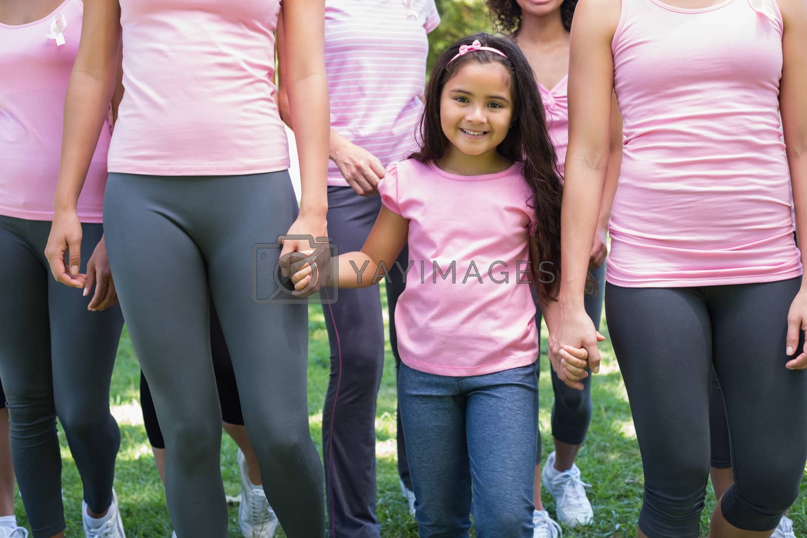Royalty free image of Volunteers supporting breast cancer campaign by Wavebreakmedia