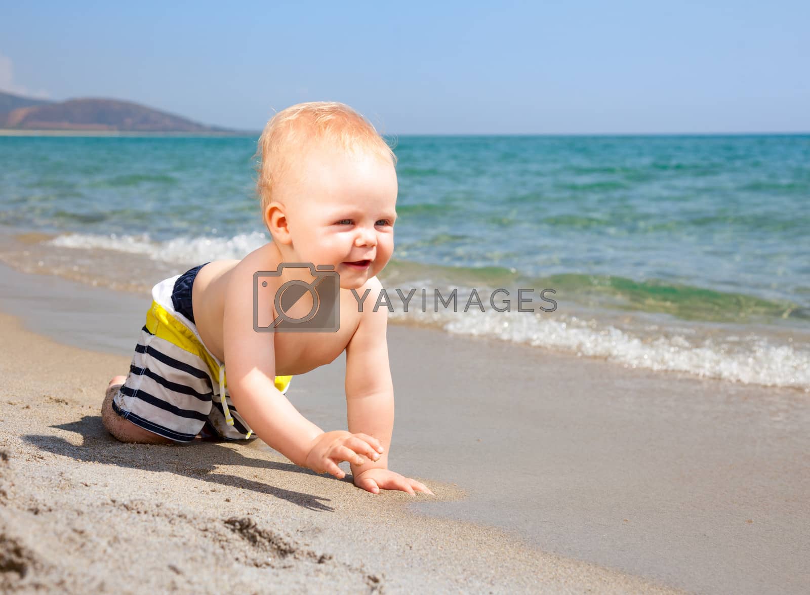Royalty free image of Infant on a beach by naumoid