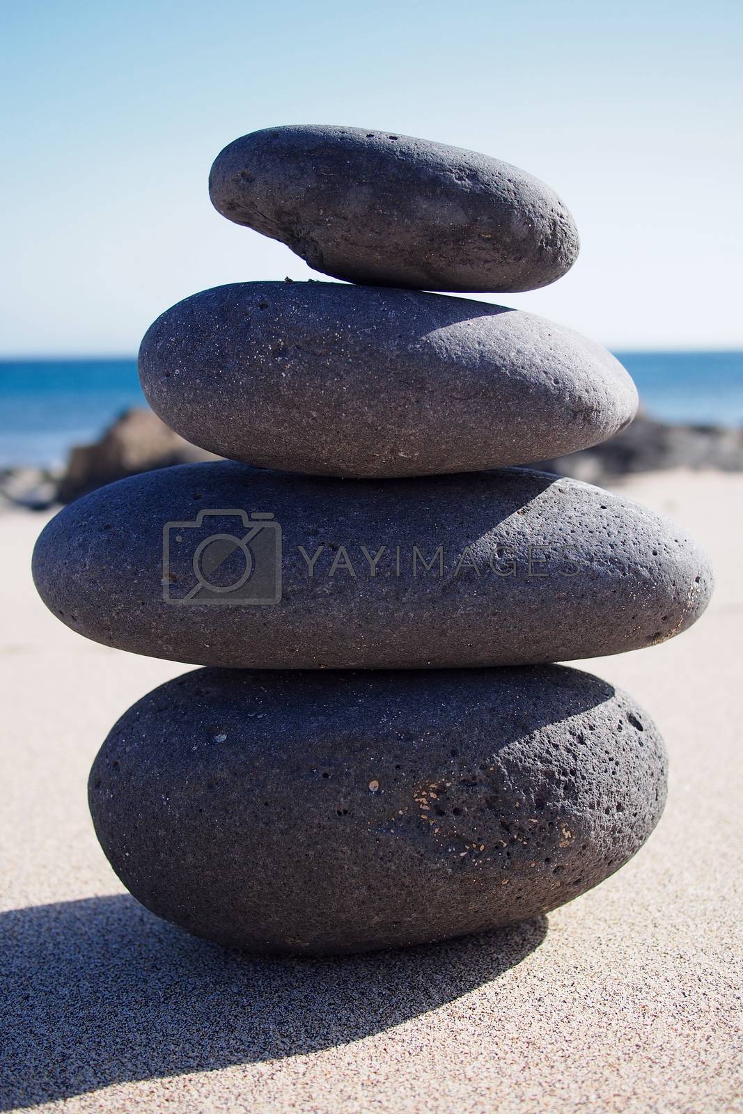 Royalty free image of Zen-like stone pyramid on the beach by stockyimages