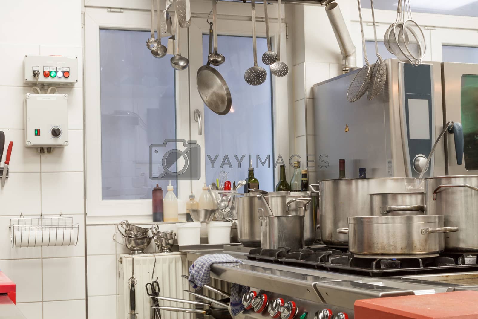 Royalty free image of Neat interior of a commercial kitchen by juniart