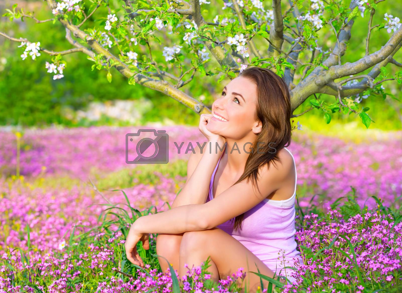 Royalty free image of Dreamy woman in blooming park by Anna_Omelchenko