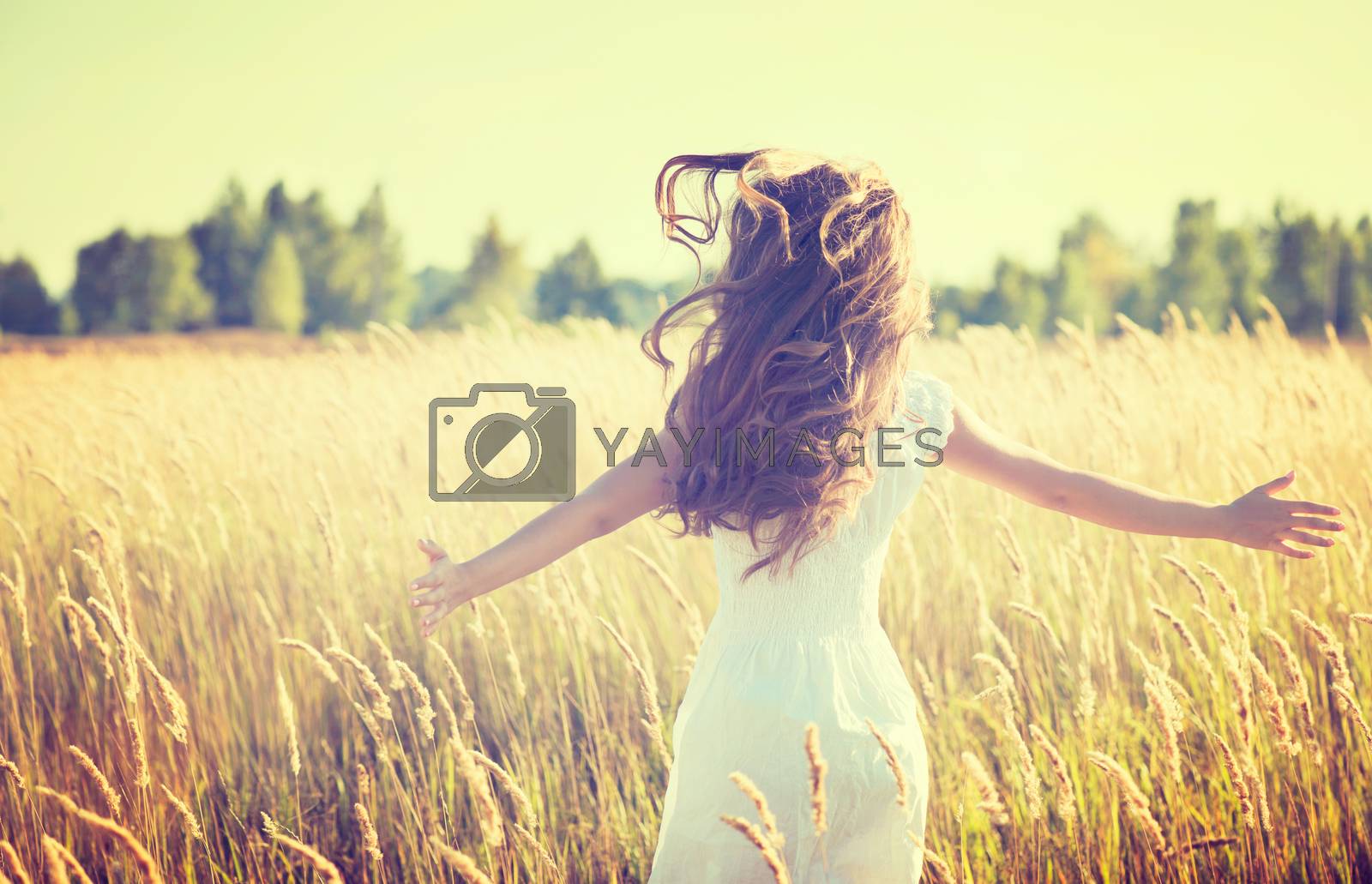 Royalty free image of Beautiful Teenage Girl Outdoors Enjoying Nature by SubbotinaA