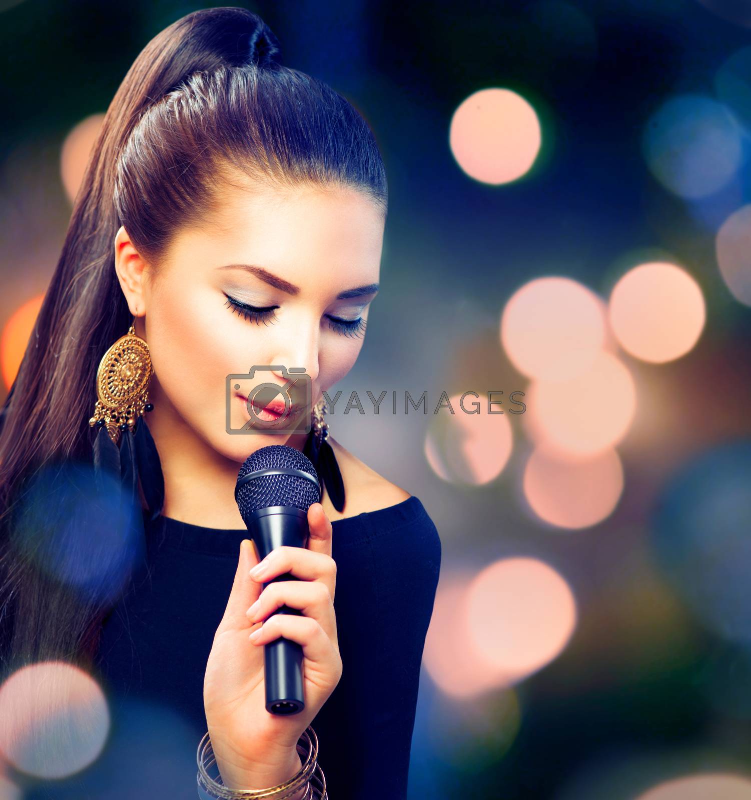 Royalty free image of Beautiful Singing Girl. Beauty Woman with Microphone by SubbotinaA