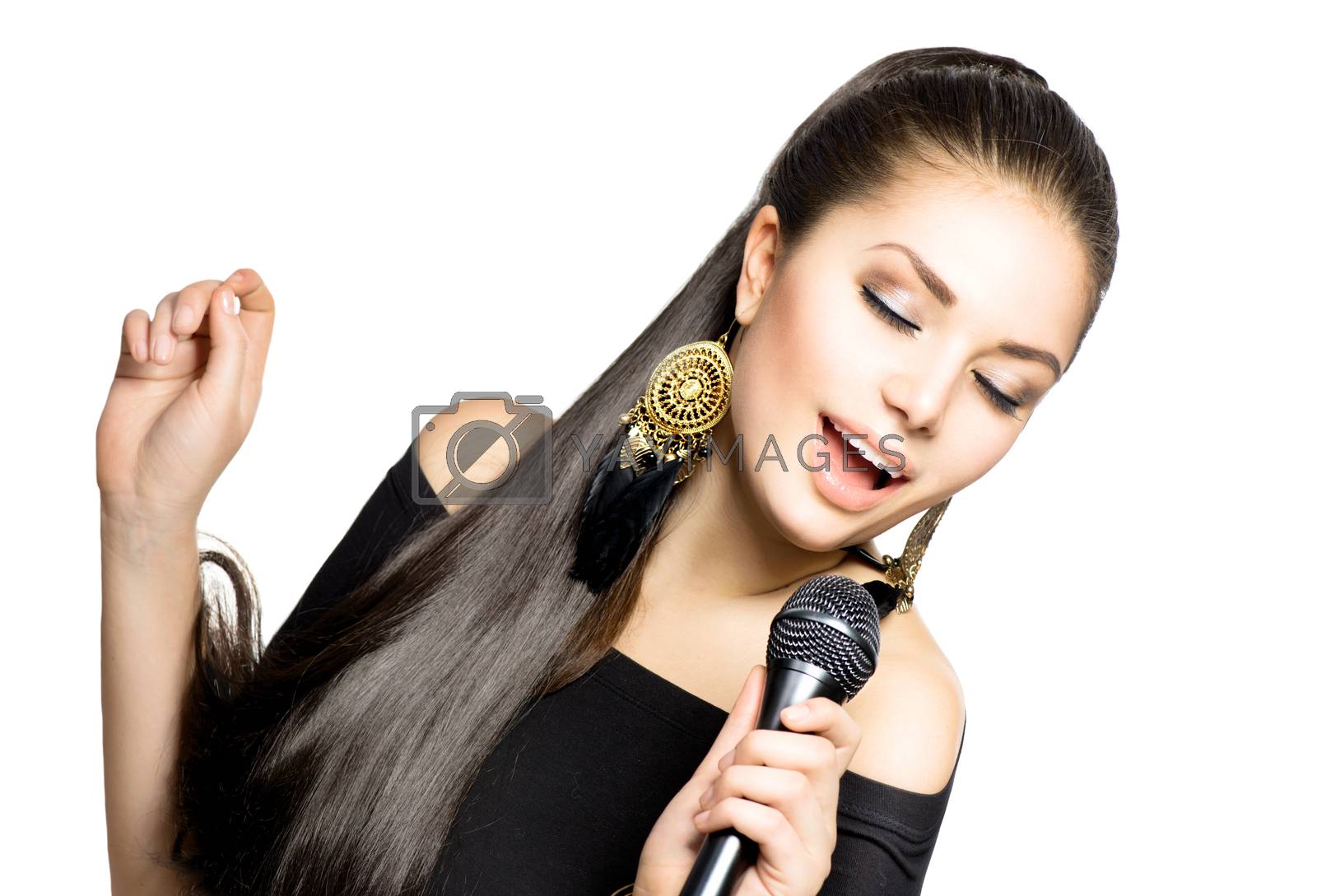 Royalty free image of Singing Woman. Beauty Woman with Microphone by SubbotinaA