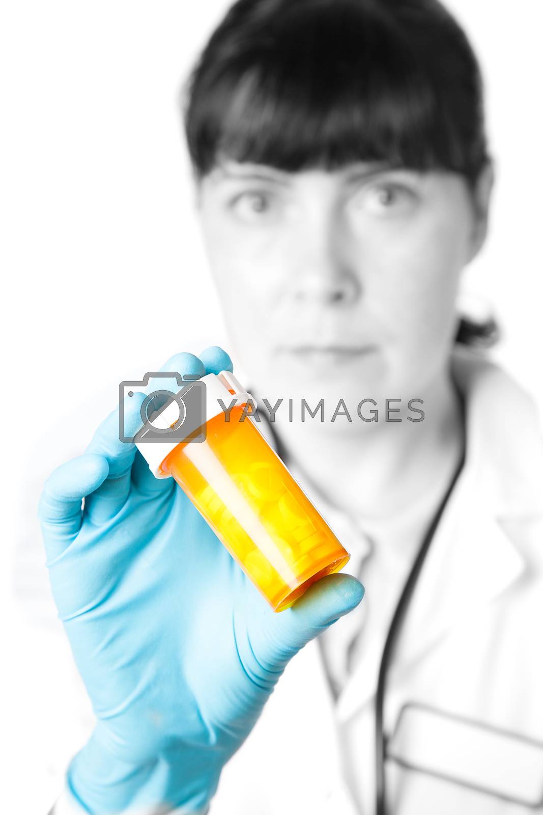 Royalty free image of Doctor or pharmacist holding a bottle of pills by motorolka