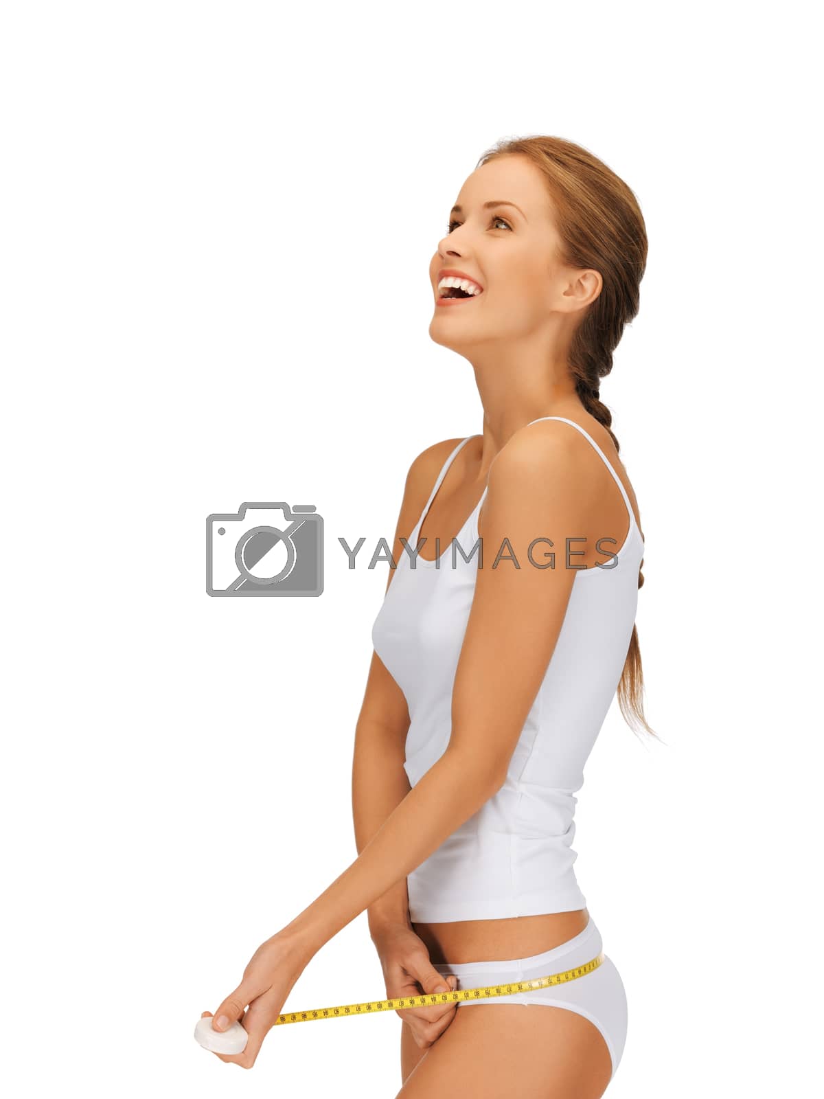 Royalty free image of woman measuring her hips by dolgachov