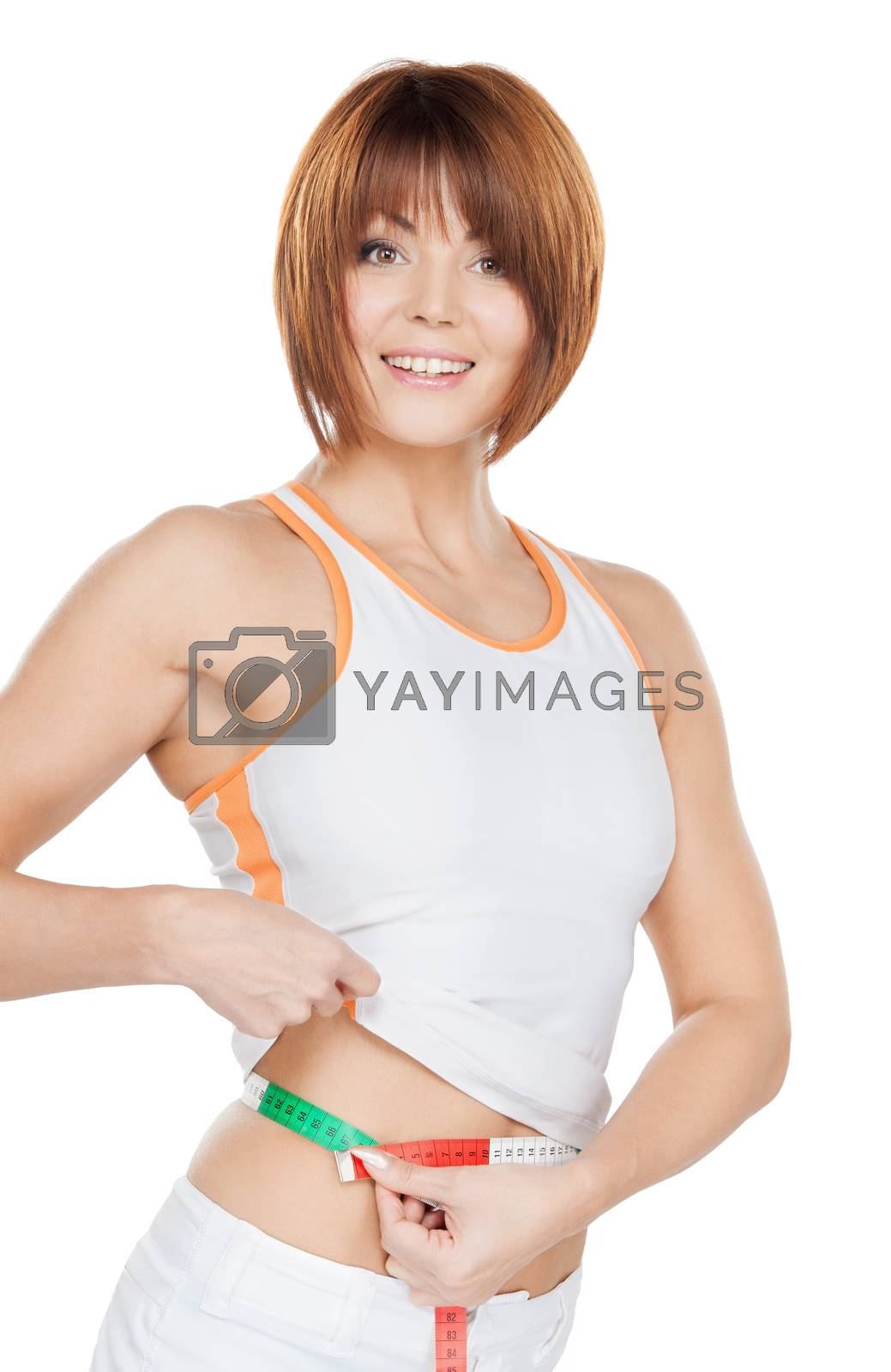 Royalty free image of woman measuring her waist by dolgachov