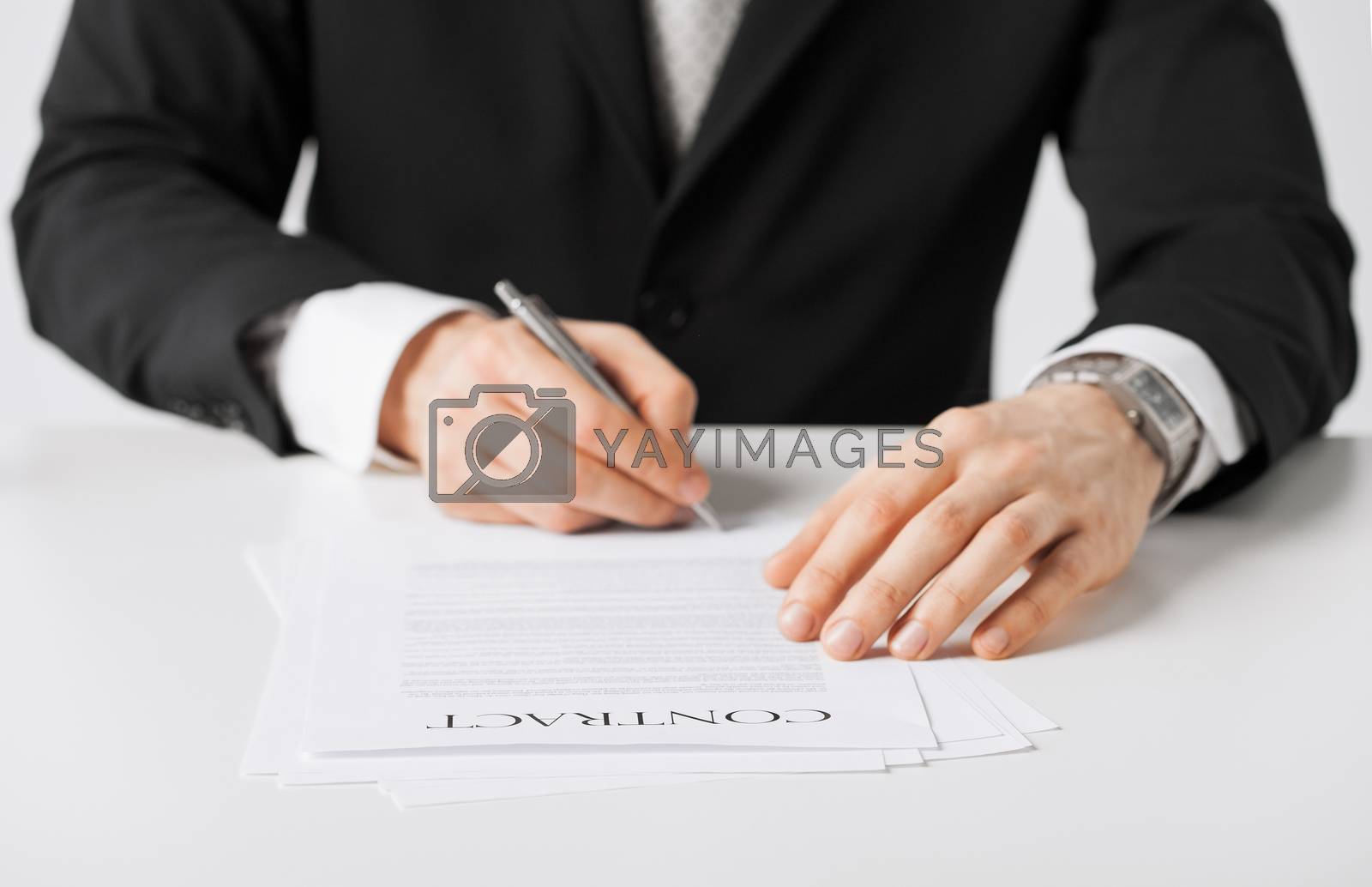 Royalty free image of man with contract by dolgachov