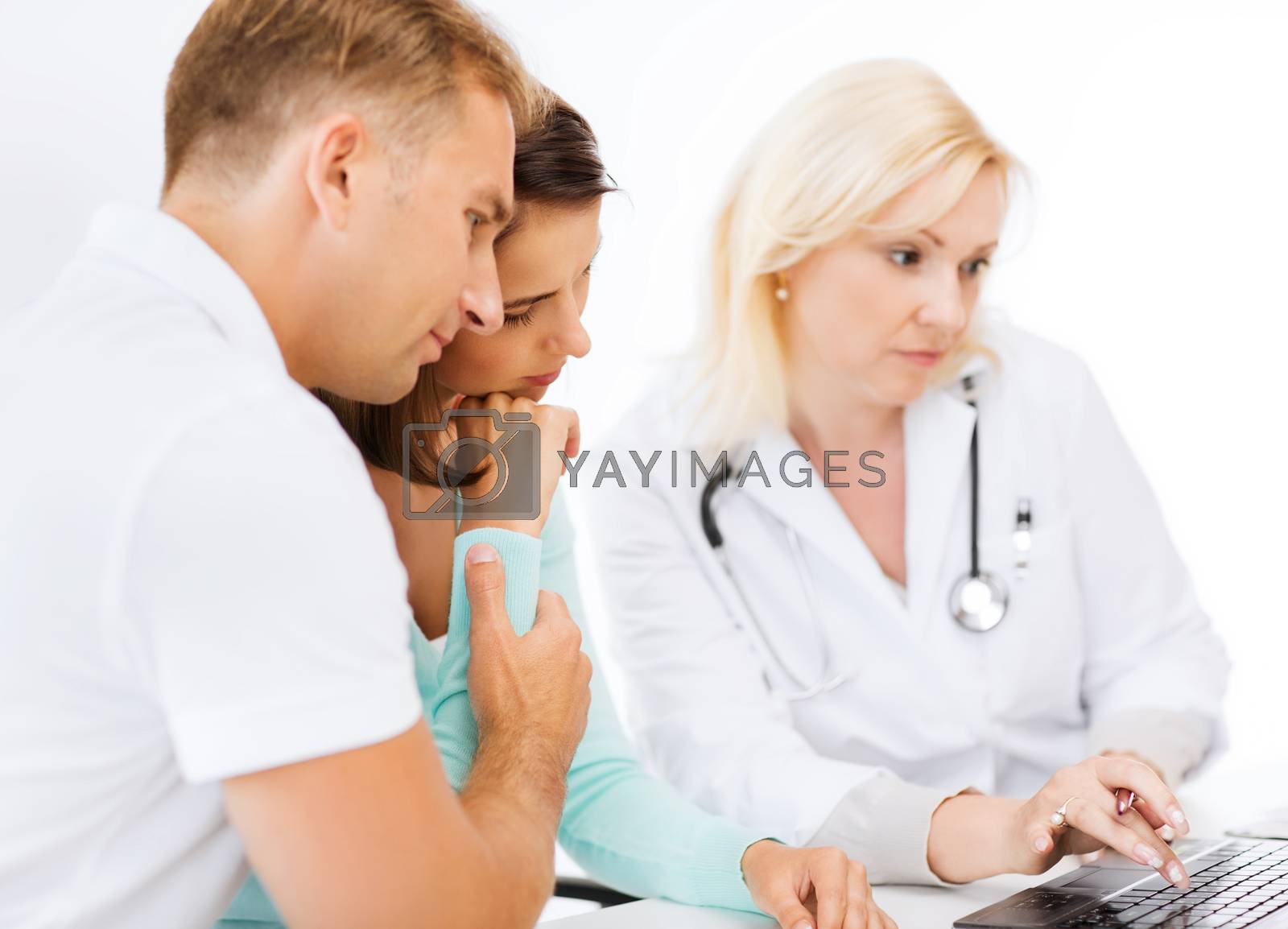 Royalty free image of doctor with patients in hospital by dolgachov
