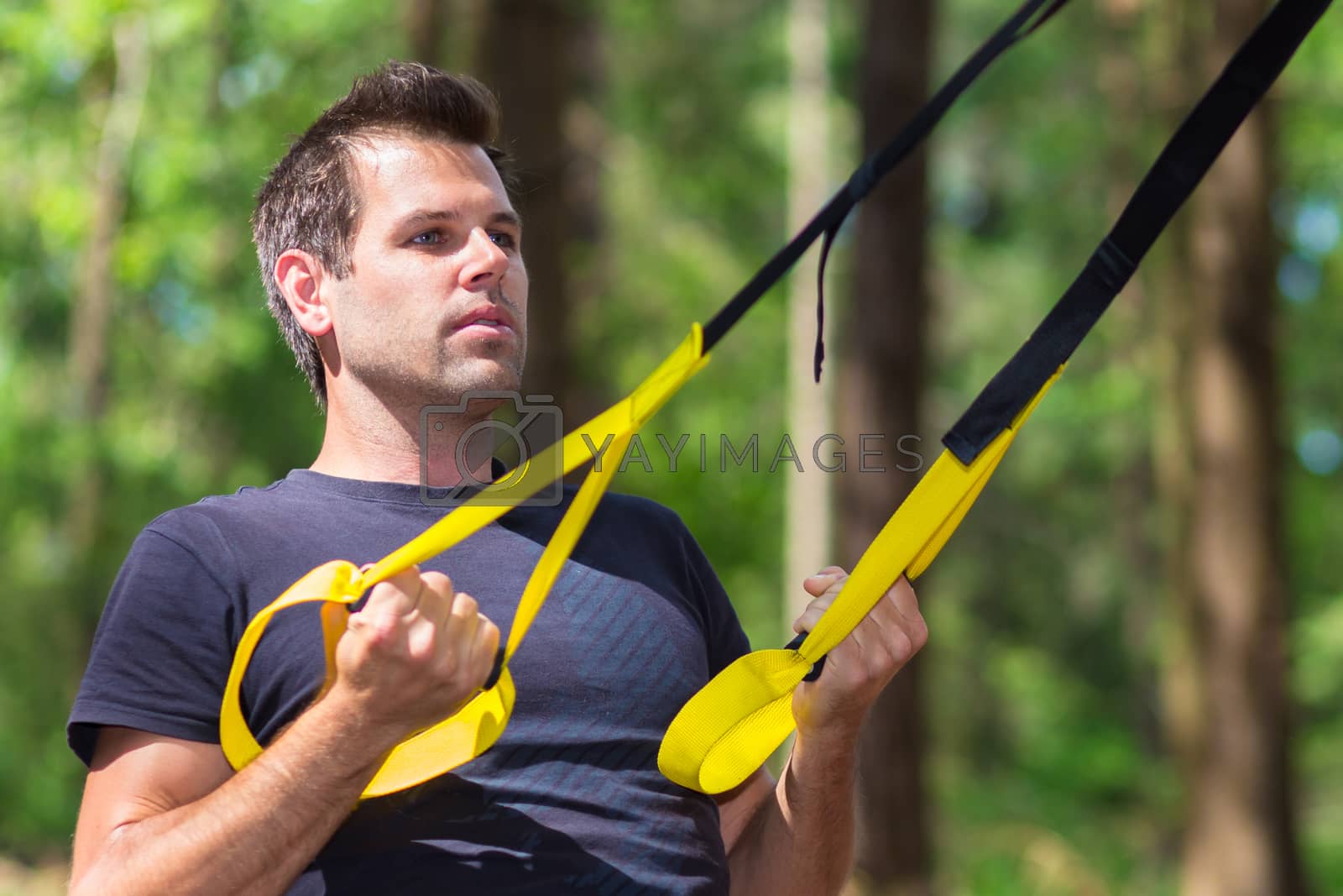 Royalty free image of Training with fitness straps outdoors. by kasto