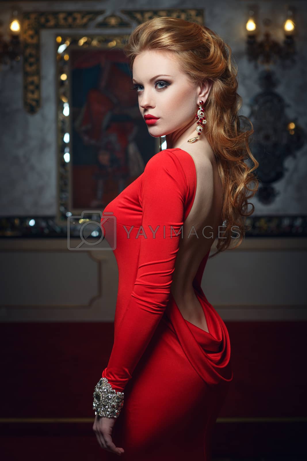 Royalty free image of Fashion portrait of young magnificent woman in red dress by fotoatelie