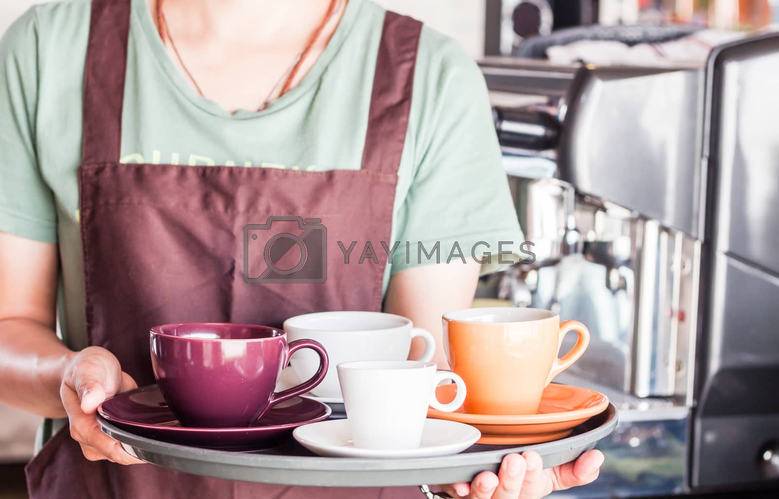Royalty free image of Barista preparing set of freshly brewed coffee for serving by punsayaporn