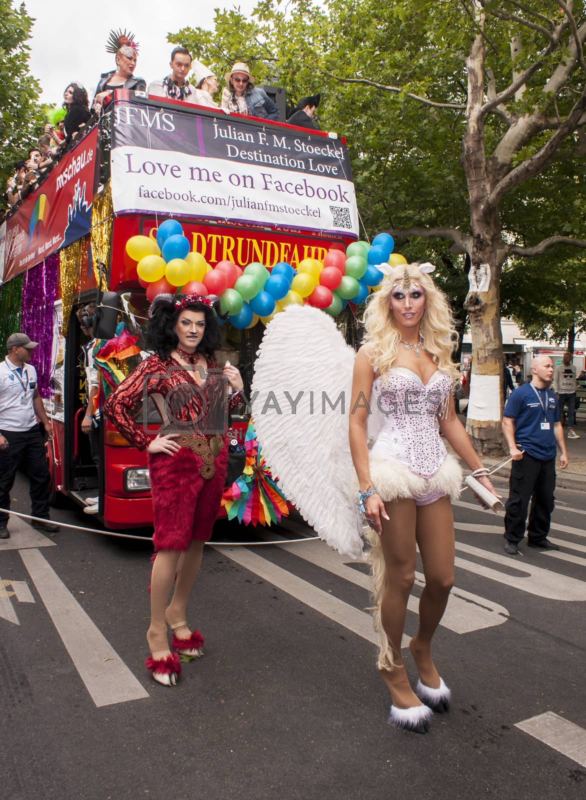 Royalty free image of Elaborately dressed participants during gay pride parade by MarekSzandurski