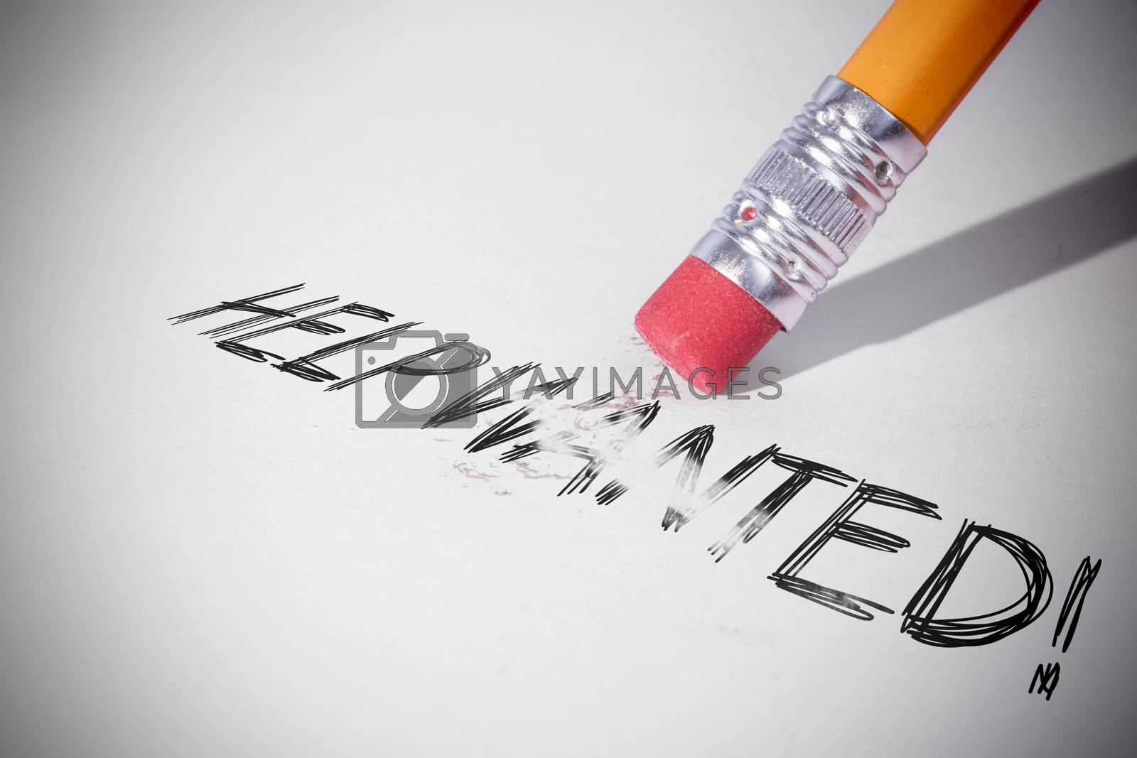 Royalty free image of Pencil erasing the word Help wanted! by Wavebreakmedia