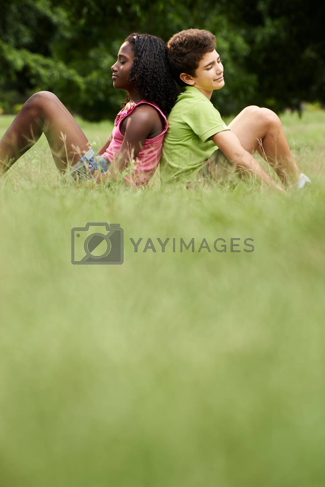 Royalty free image of Interracial couple of black and white kids in love by diego_cervo