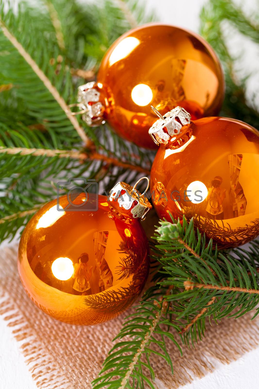 Royalty free image of Shiny bright copper colored Christmas balls by juniart