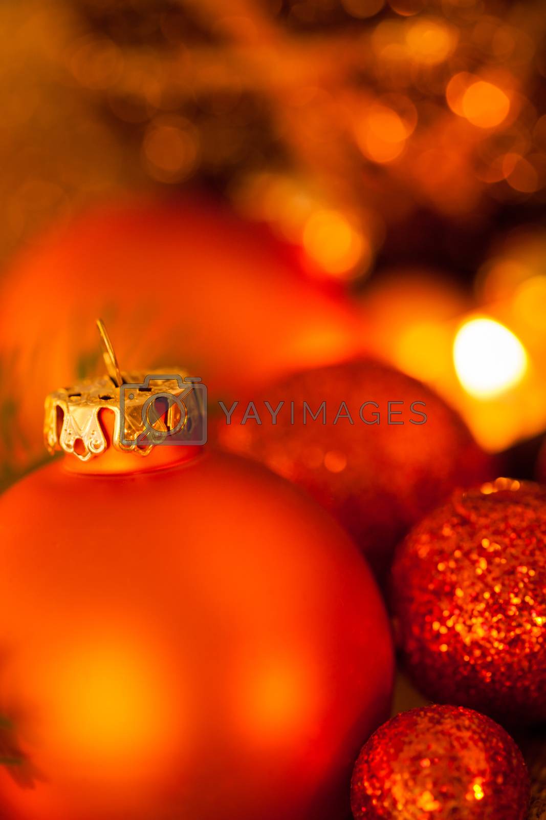Royalty free image of Warm gold and red Christmas candlelight background by juniart