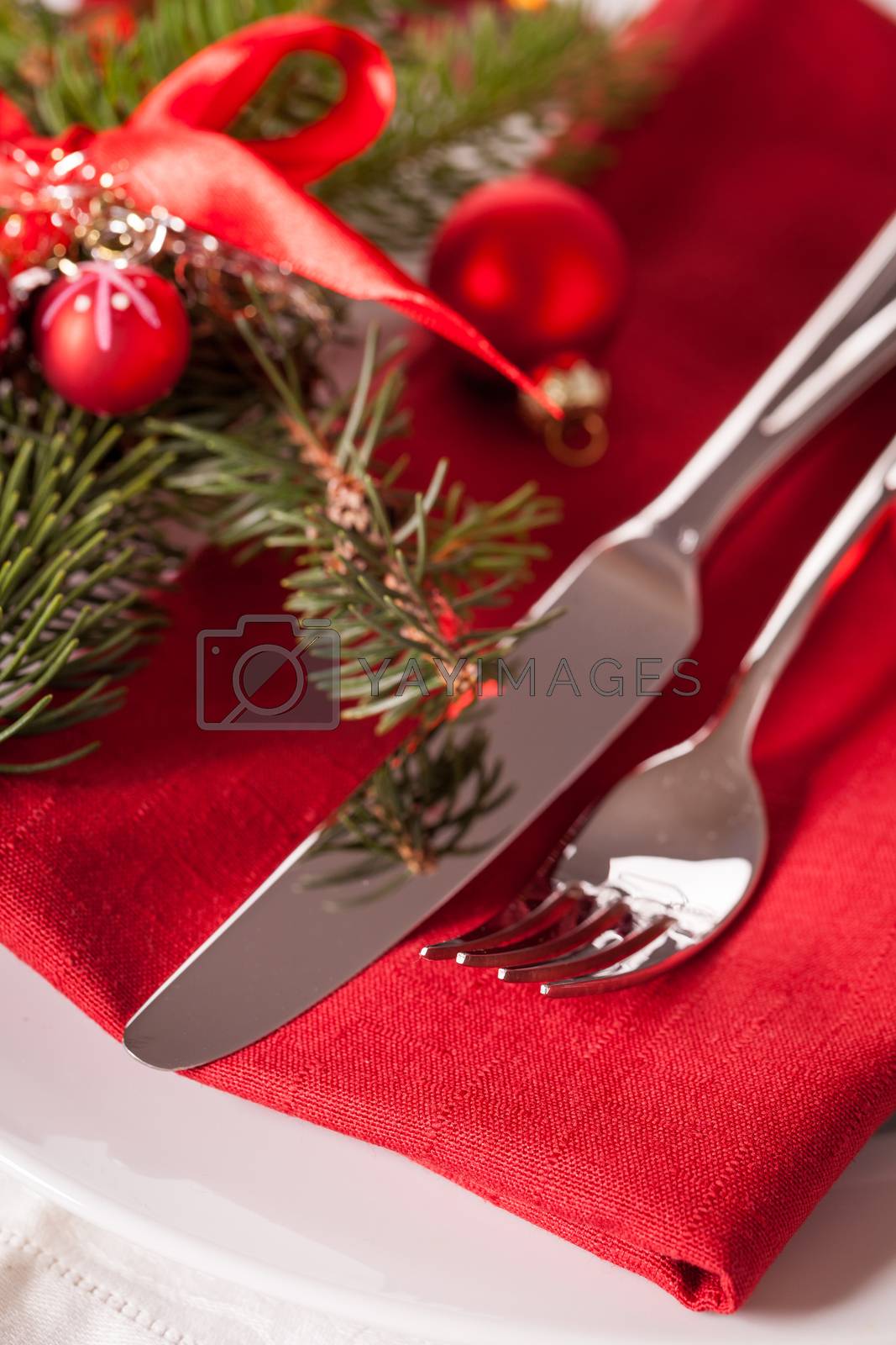 Royalty free image of Red themed Christmas place setting by juniart