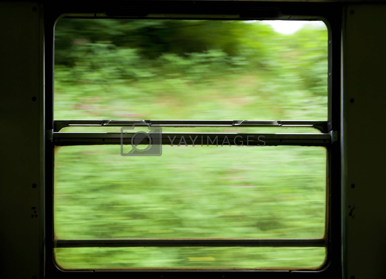 Royalty free image of view of moving train window by courtyardpix