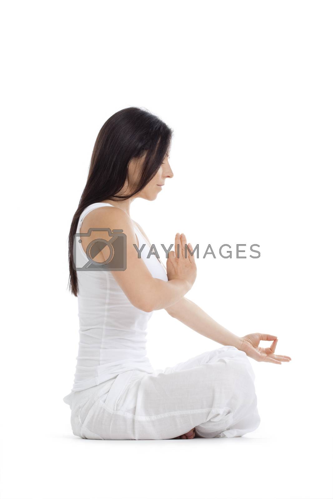 Royalty free image of woman exercising yoga by courtyardpix
