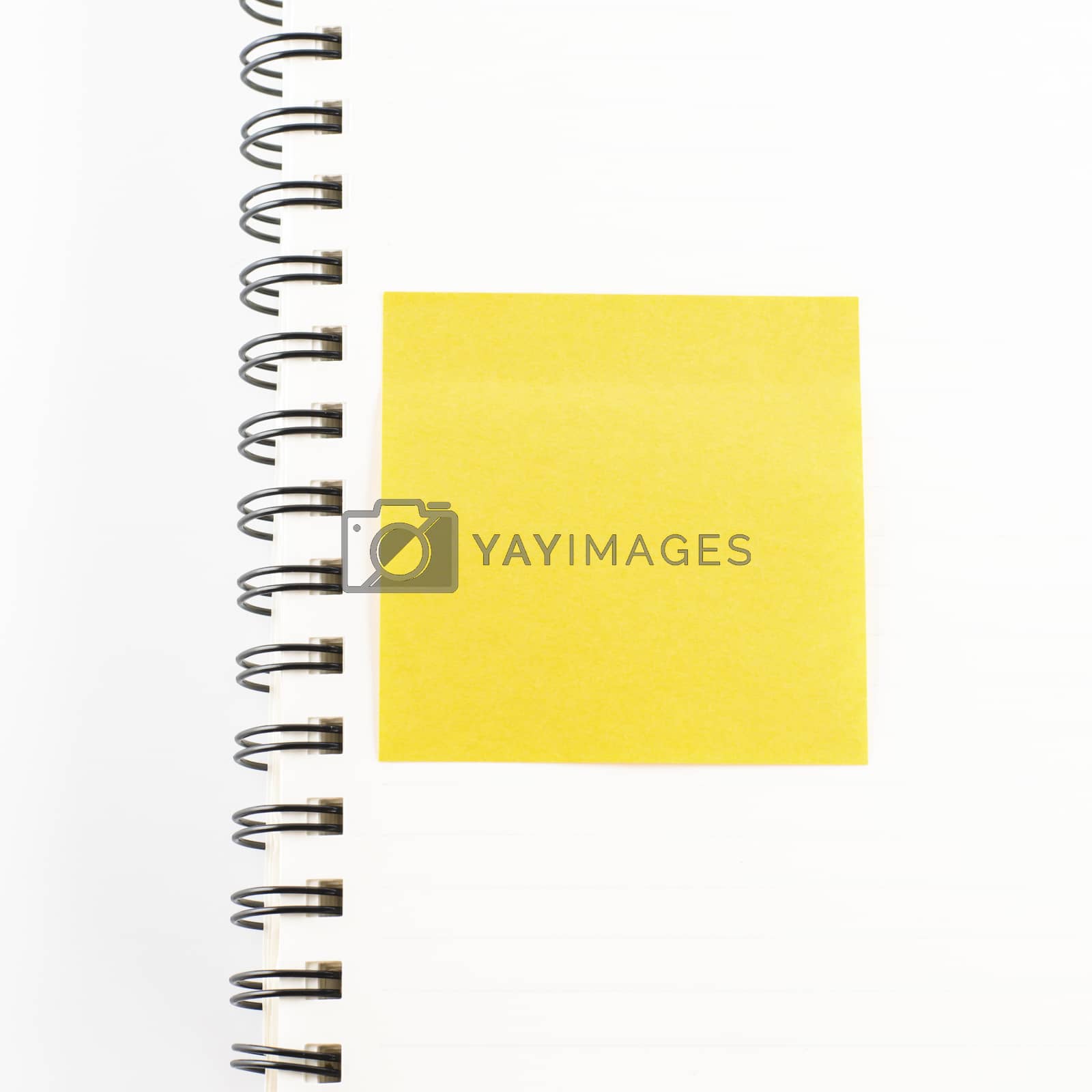 Royalty free image of sticker note on notebook by ammza12